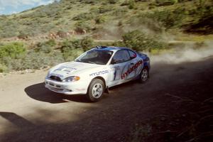 Paul Choinere / Jeff Becker at speed near the start of SS1 in their Hyundai Tiburon.