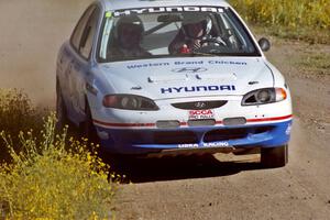 The Noel Lawler / Charles Bradley Hyundai Elantra at speed near the start of SS1.