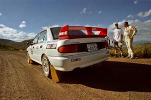 The Tony Takaori / Ken Cassidy Mitsubishi Lancer Evo III leaves the start of SS1.