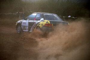 Lee Shadbolt / Paul Eklund blast their Subaru Impreza through the spectator corner at sundown.