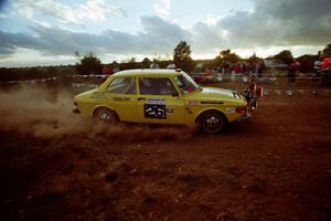 The Tom Bier / Ole Holter SAAB 99 through the spectator corner at sundown.