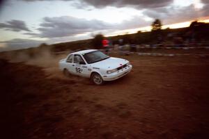 Roland McIvor / John Forespring Nissan Sentra SE-R at speed through the spectator corner at sundown.