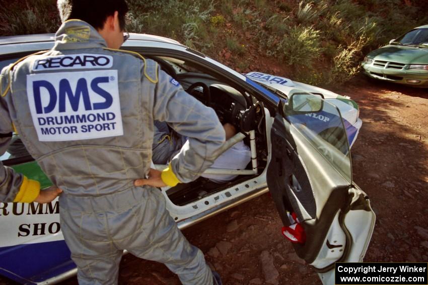 The Hiroyuki Genta / Kazmasa Takata Subaru Impreza gets last minute prep before the start of the rally.