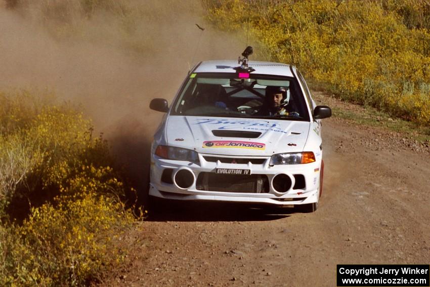 The David Summerbell / Mike Fennell Mitubishi Lancer Evo IV goes into the first hard corner of SS1.