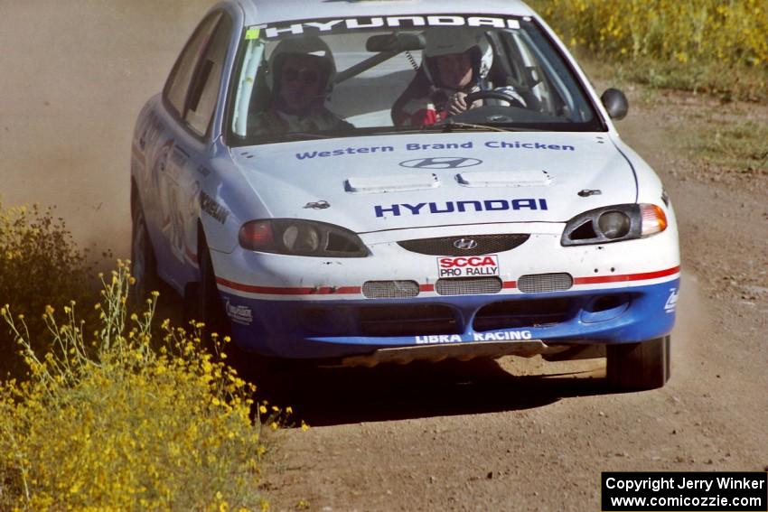 The Noel Lawler / Charles Bradley Hyundai Elantra at speed near the start of SS1.