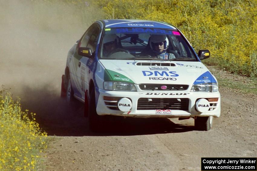 The Hiroyuki Genta / Kazmasa Takata Subaru Impreza near the start of SS1.