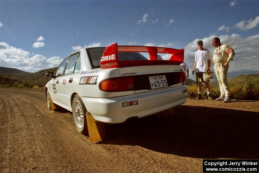 The Tony Takaori / Ken Cassidy Mitsubishi Lancer Evo III leaves the start of SS1.