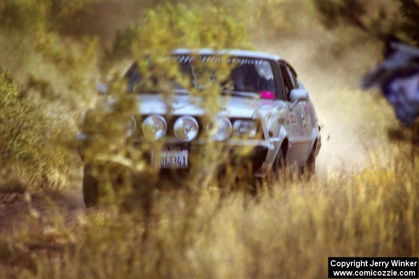 The Lon Peterson / Peter Workum Plymouth Fire Arrow comes uphill at speed into the spectator corner.