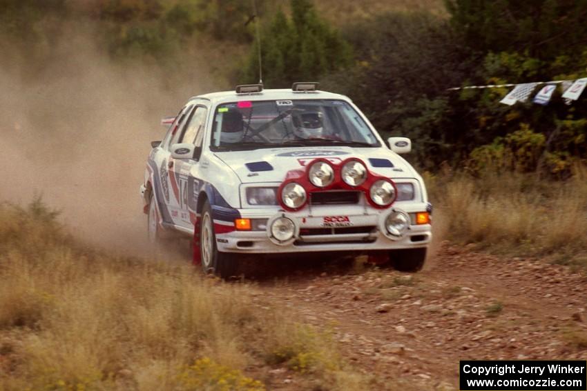 The Garen Shrader / Doc Shrader Ford Sierra Cosworth comes into the spectator corner before sundown.