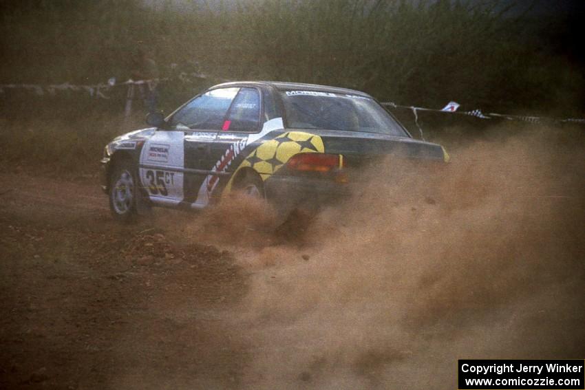 Lee Shadbolt / Paul Eklund blast their Subaru Impreza through the spectator corner at sundown.