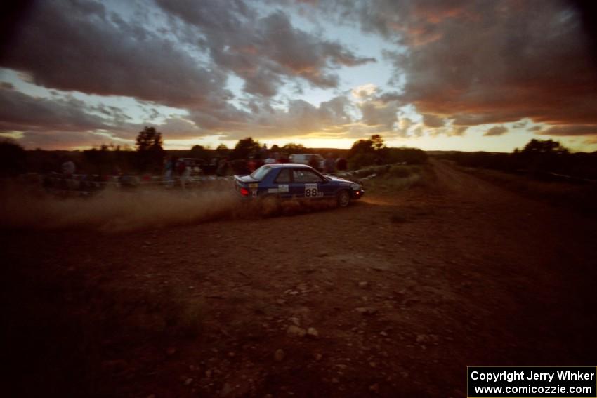 The Kendall Russell / Lynn Dillon Dodge Shadow comes through the specator corner into a long straight with a beautiful sunset.