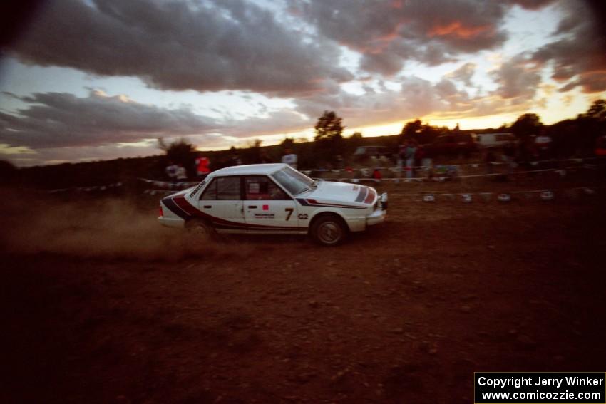 The Sergei Bellesov / Catherine Roso Mazda 626 just after sunset at the spectator point.