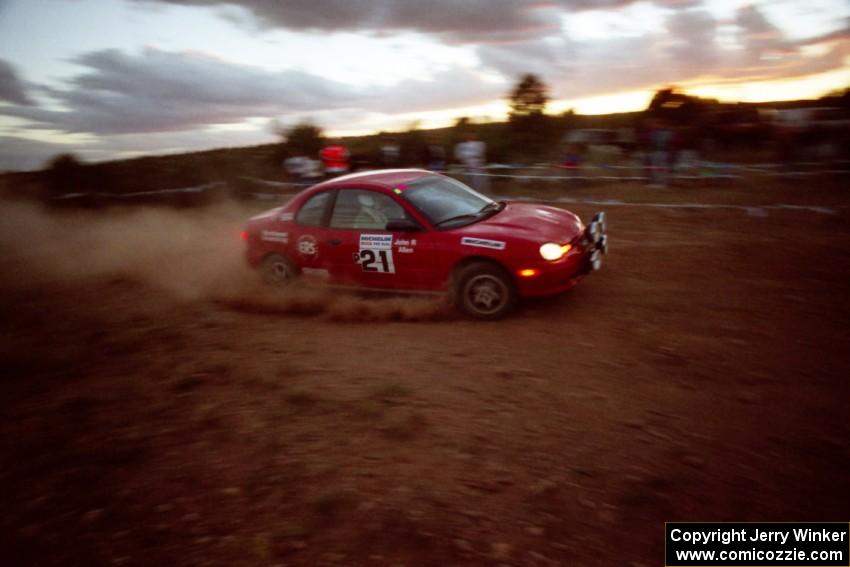 The Trevor Donison / John Allen Dodge Neon ACR at speed through the spectator point at sundown.