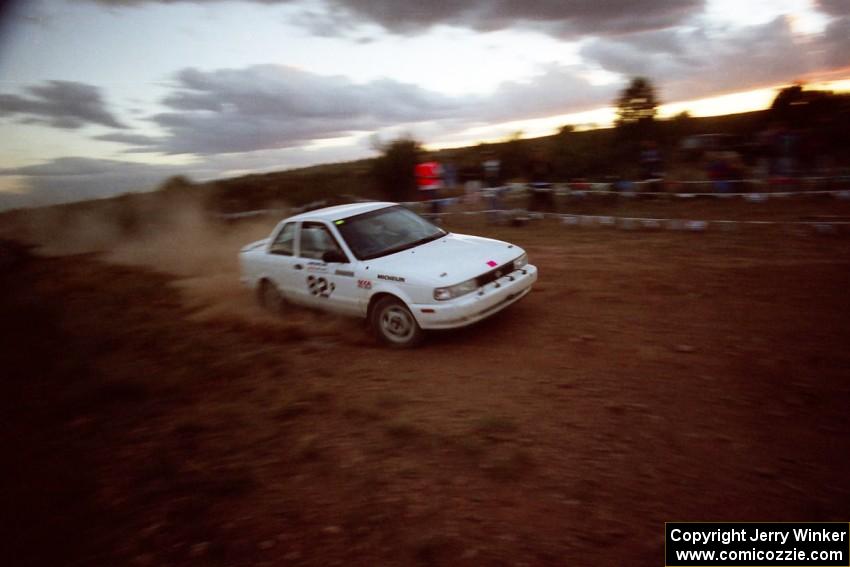 Roland McIvor / John Forespring Nissan Sentra SE-R at speed through the spectator corner at sundown.