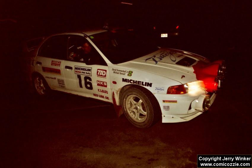 The David Summerbell / Mike Fennell Mitubishi Lancer Evo IV checks into the final MTC at the headquarters.