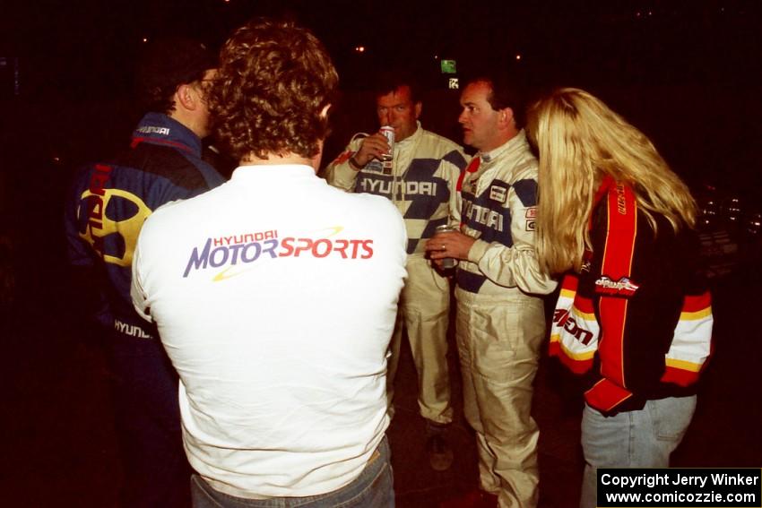 L to R) Jeff Becker, a Hyundai crew member, Charles Bradley, Noel Lawler and his wife converse at the finish of the event.