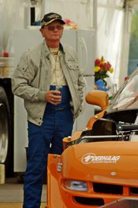 Jim Derhaag next to his Chevy Corvette