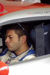 R.J. Lopez sits in his Chevy Corvette before qualifying