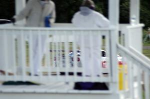 Corner worker Beryl Ann Burton watches R.J. Lopez's Chevy Corvette go past her turn two station.