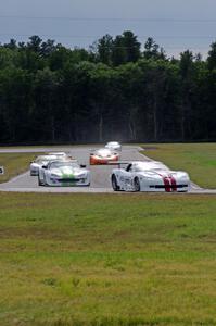 Tony Ave leads Tomy Drissi, R.J. Lopez, Bobby Sak, Jim Derhaag, Simon Gregg and Buddy Cisar on the first lap into turn 4.