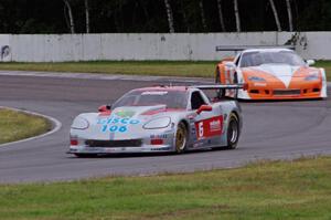 R.J. Lopez tries to fend off Simon Gregg, both in Chevy Corvettes