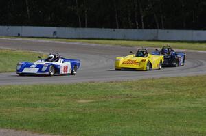 Dave Schaal's, Carl Harris' and Robert Reed's Spec Racer Fords go through the carousel