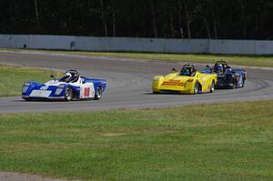 Dave Schaal's, Carl Harris' and Robert Reed's Spec Racer Fords go through the carousel
