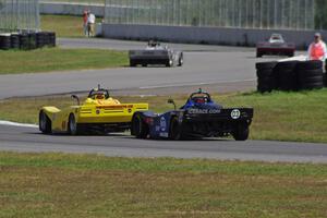 Carl Harris' and Robert Reed's Spec Racer Fords exit the carousel