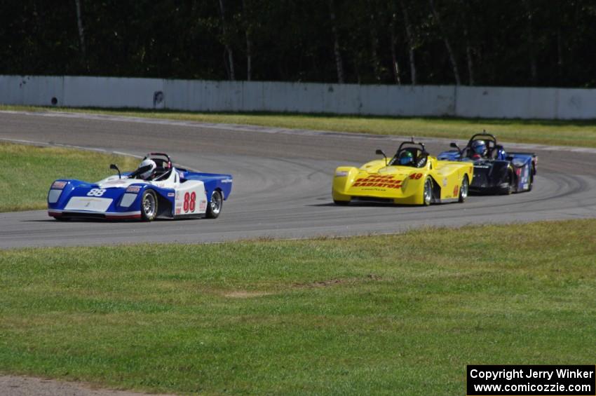 Dave Schaal's, Carl Harris' and Robert Reed's Spec Racer Fords go through the carousel