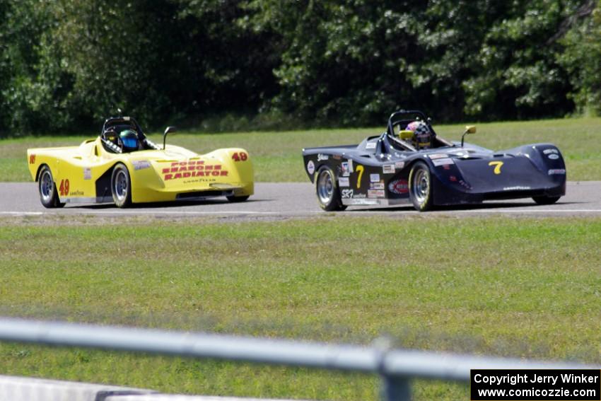 Tray Ayers leads Carl Harris into turn six during the Spec Racer Ford race