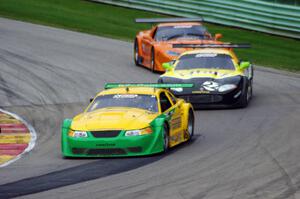 John Baucom's Ford Mustang, Carlos de Quesada's Jaguar XKR and Doug Harrington's Chevy Corvette