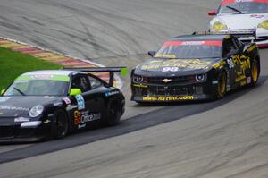 Scott Tucker's Porsche GT3 Cup, Bob Stretch's Chevy Camaro and Gary Stewart's Porsche 996