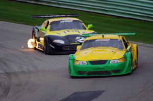 John Baucom's Ford Mustang and Carlos de Quesada's Jaguar XKR