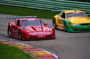 Amy Ruman's Chevy Corvette inside of John Baucom's Ford Mustang