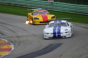 Cliff Ebben's Ford Mustang gets past Tony Ave's Chevy Corvette