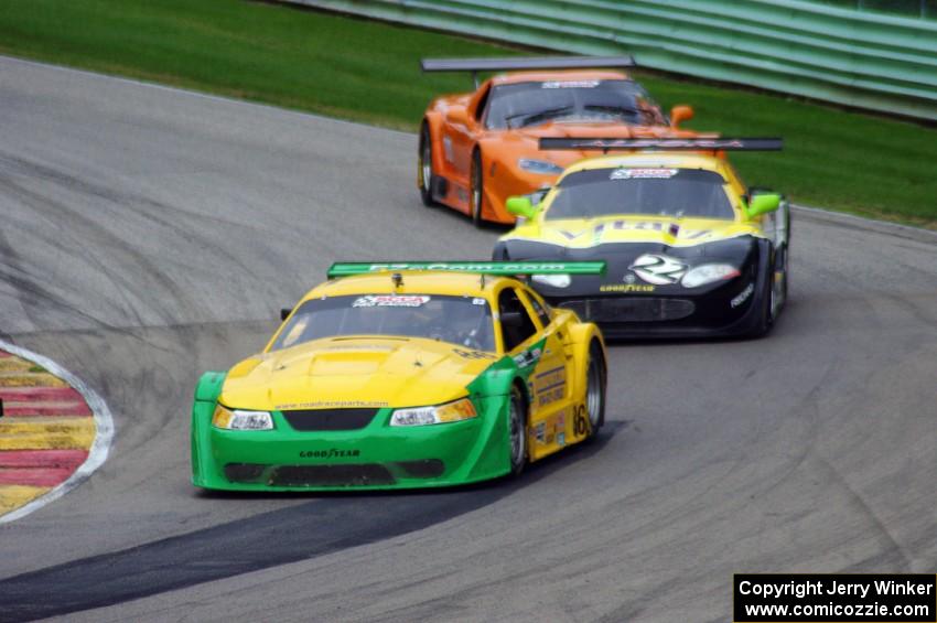 John Baucom's Ford Mustang, Carlos de Quesada's Jaguar XKR and Doug Harrington's Chevy Corvette