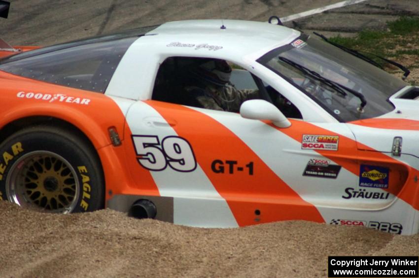 Simon Gregg's Chevy Corvette stopped in the gravel trap at turn 12