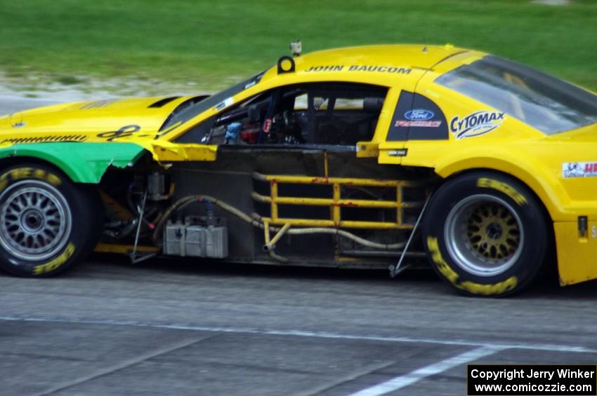 John Baucom's Ford Mustang was missing some bodywork late in the race