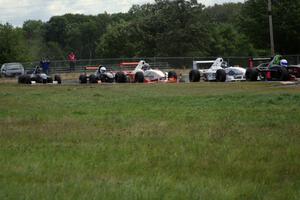 Patrick Gallagher, Jason Wolfe, Scott Rettich, Jim Libecco, Matt Schneider and Shaun Miller battle on lap one