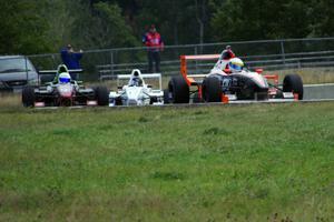 Patrick Gallagher, Jason Wolfe and Scott Rettich battle in the Formula Enterprises race