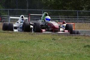 Jason Wolfe, Scott Rettich and Patrick Gallagher battle in the Formula Enterprises race