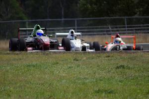 Jason Wolfe, Scott Rettich and Patrick Gallagher battle in the Formula Enterprises race