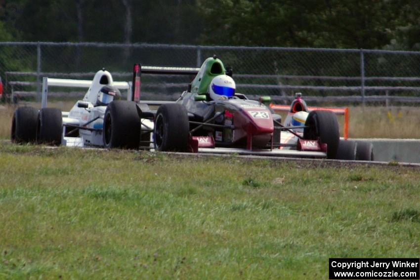 Jason Wolfe, Scott Rettich and Patrick Gallagher battle in the Formula Enterprises race