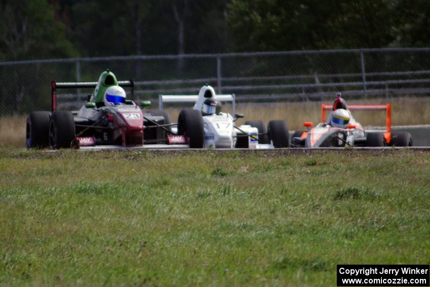 Jason Wolfe, Scott Rettich and Patrick Gallagher battle in the Formula Enterprises race
