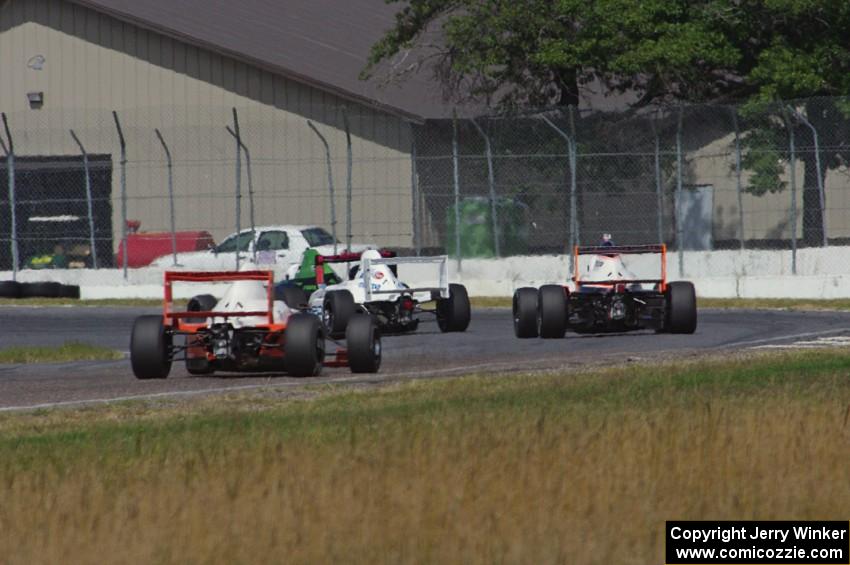 Jason Wolfe, Scott Rettich, Patrick Gallagher and Jim Libecco battle in the Formula Enterprises race