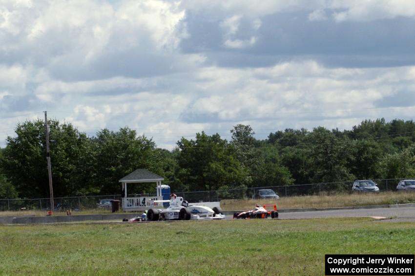 Scott Rettich, Jason Wolfe and Patrick Gallagher battle late in the Formula Enterprises race