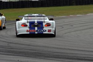 Daniel Ramoutarsingh's Jaguar XKR passes Tim Gray's Porsche GT3 Cup