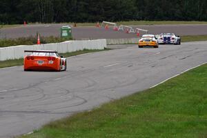 Daniel Ramoutarsingh's Jaguar XKR, Tim Gray's Porsche GT3 Cup and Simon Gregg's Chevy Corvette head into turn 1