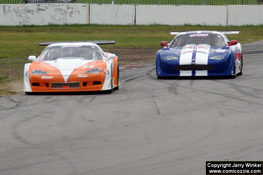 Simon Gregg's Chevy Corvette and Daniel Ramoutarsingh's Jaguar XKR battle for second