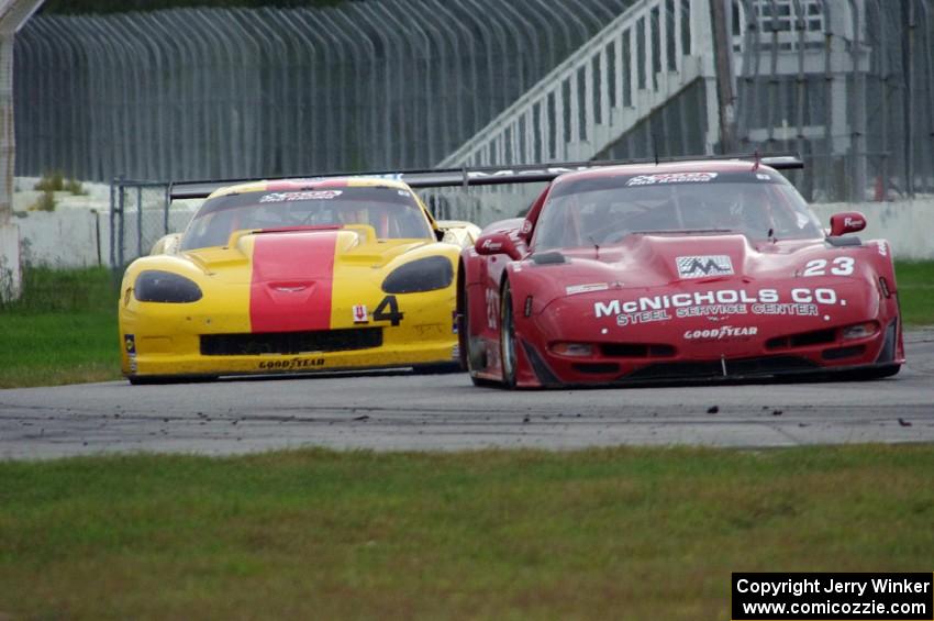Amy Ruman's Chevy Corvette tries to avoid being lapped by Tony Ave's Chevy Corvette
